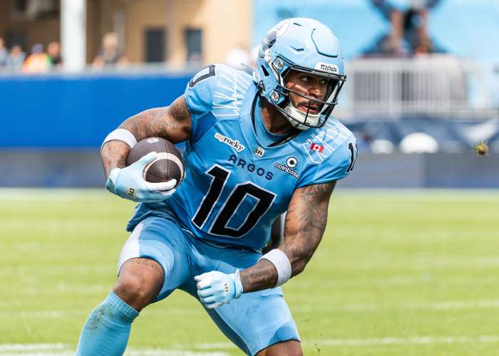 TORONTO, ON - Sep. 12, 2026: Kevin Mital of the Toronto Argos runs with the ball in a regular season CFL game against the Ottawa Redblacks.