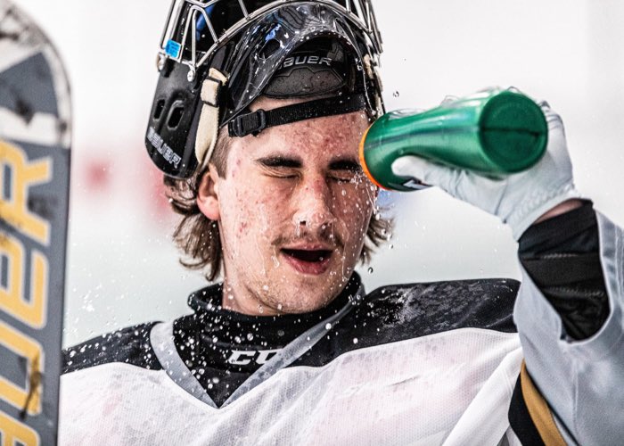 OAKVILLE, ON, Nov. 22, 2023: Milton Menace goalkeeper sprays himself with water before the start of the first period at Sixteen Mile Sports Complex.