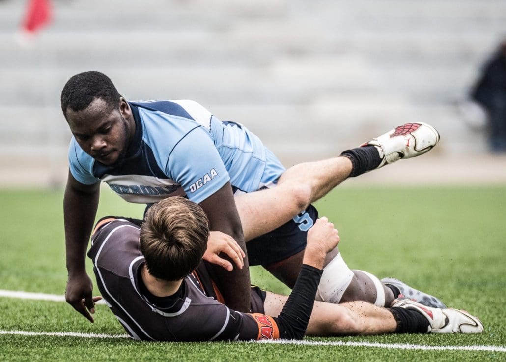 OAKVILLE, ON - Oct. 1, 2016: Players stare each other down following a rough tackle in a game between the Sheridan Bruins and Mohawk Mountaineers.