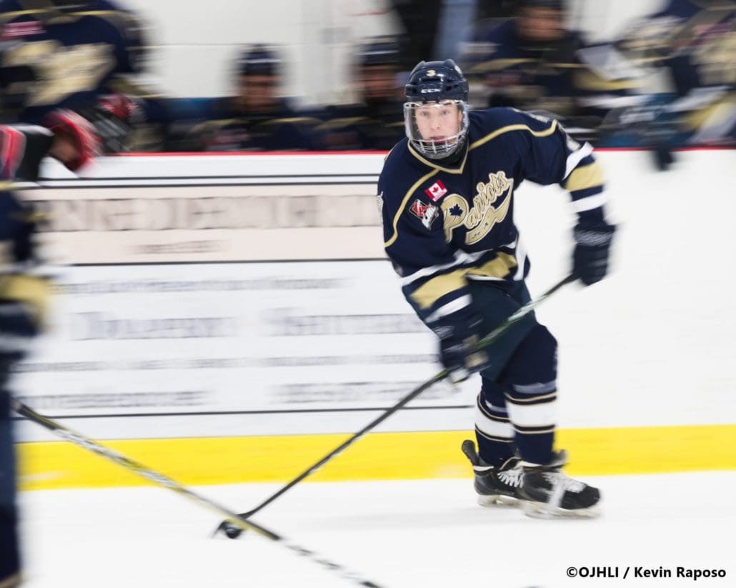 GEORGETOWN, ON - FEB. 14, 2018: Ontario Junior Hockey League game between the Georgetown Raiders and the Toronto Patriots, Nicholas Favaro #3 of the Toronto Patriots speeds down the ice and tries to make a pass during the first period.
