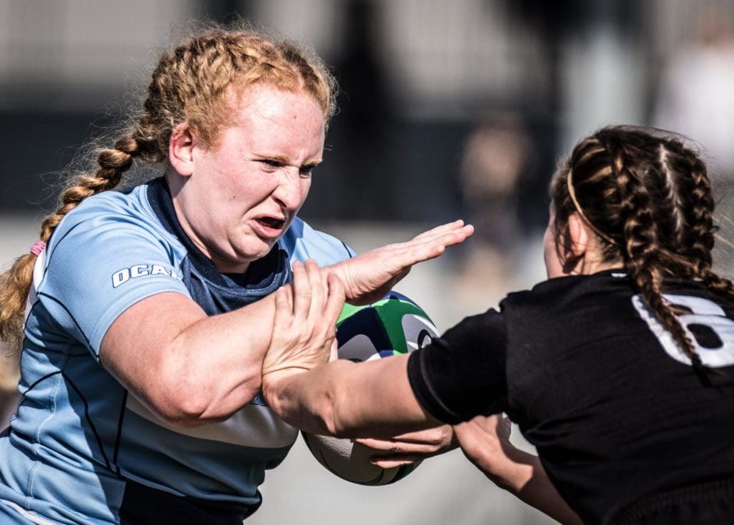 OAKVILLE, ON - NOV. 5, 2016: Kirsten Archer charges past a Seneca defender at the inaugural OCAA Women's Rugby Sevens championship.