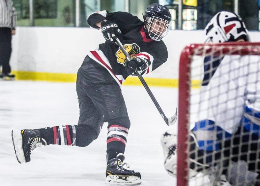 BURLINGTON, ON - Dec. 11, 2016: Blackhawks player reacts after a shot on goal in Wave Sports hockey action.