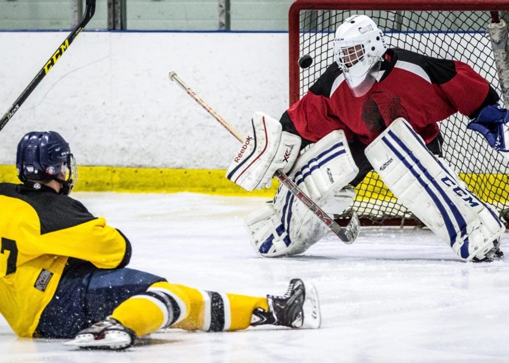 BURLINGTON, ON - Dec. 11, 2016: A Bruins player has a shot on goal in Wave Sports hockey action.