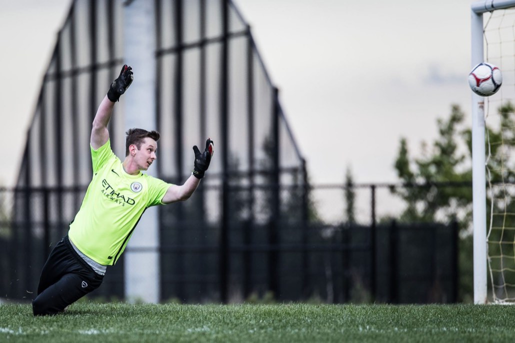 OAKVILLE, ON - May 22, 2017: A goalkeeper can only watch as a shot flies toward goal.