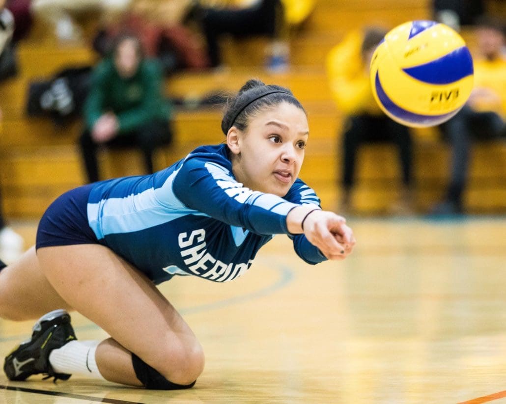 OAKVILLE, ON - JAN. 13, 2018: Sydney Romans of the Sheridan Bruins dives during OCAA women's volleyball action against the St. Clair Saints.