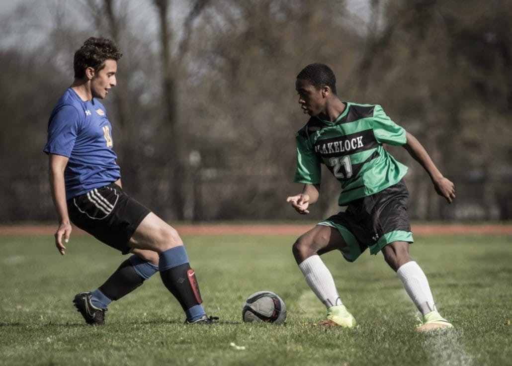 Sport Photography – Player Tries to Beat Opponent