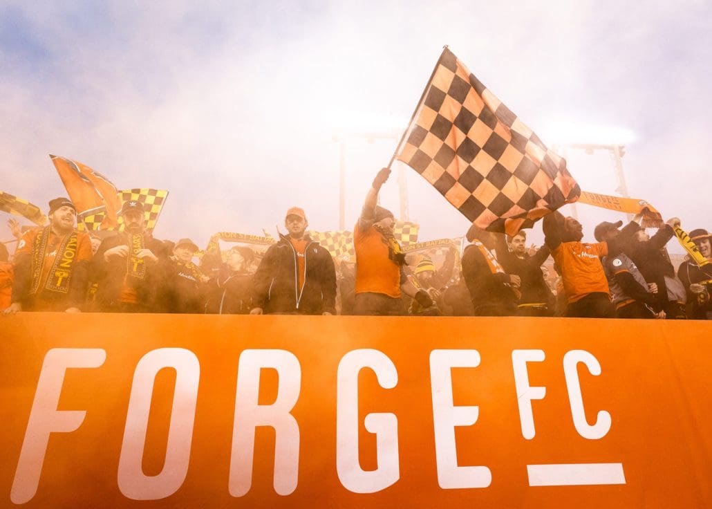 HAMILTON, ON - OCT. 26, 2019: Forge FC fans celebrate at Tim Hortons Field after a 1-0 win over Cavalry FC in the first leg of the Canadian Premier League Finals.