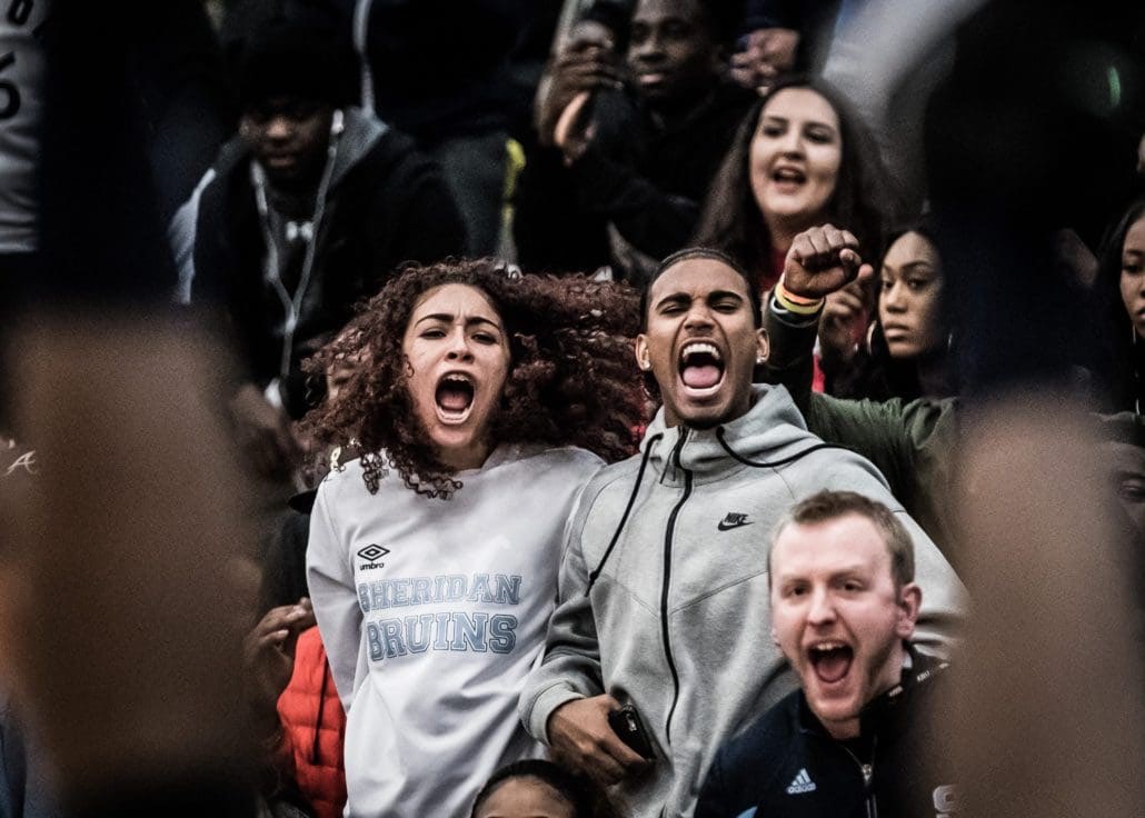 TORONTO, ON – MAR. 3, 2017: Sheridan fans react after Paul Williams drains a basket (in the foreground) and gets the foul.
