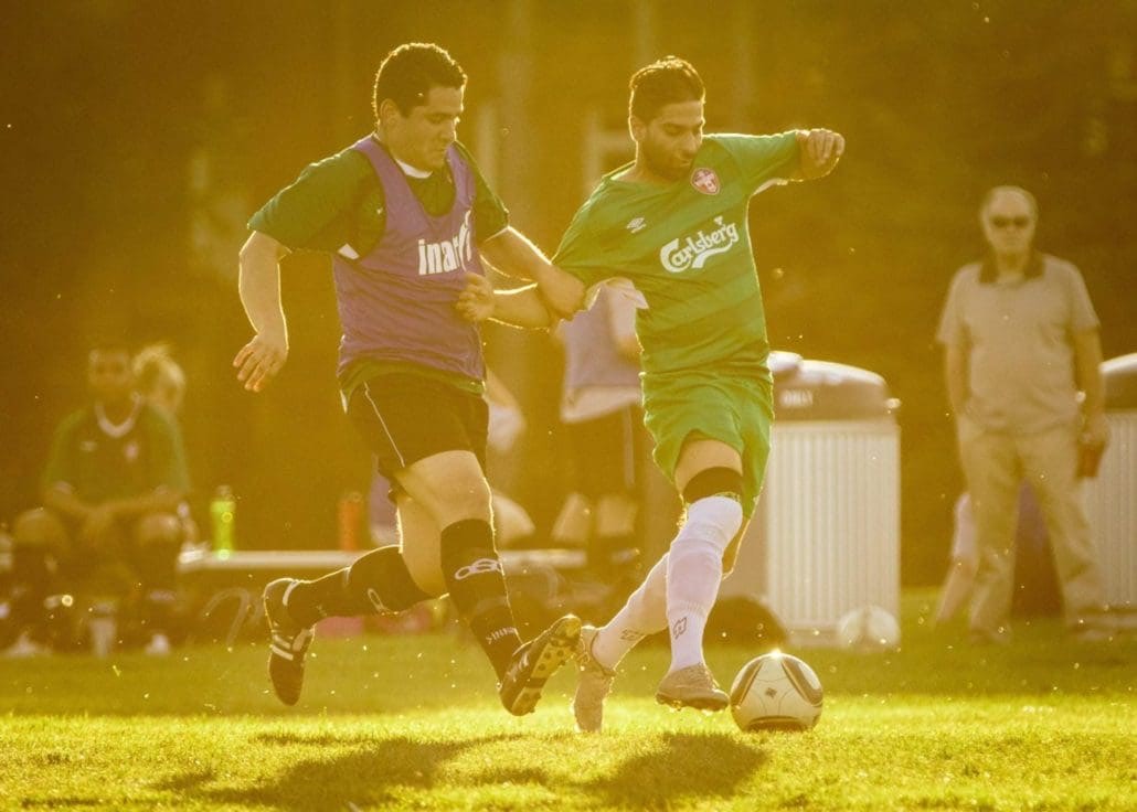 Sport Photography – Players Battle for the Ball at Sunset in Oakville