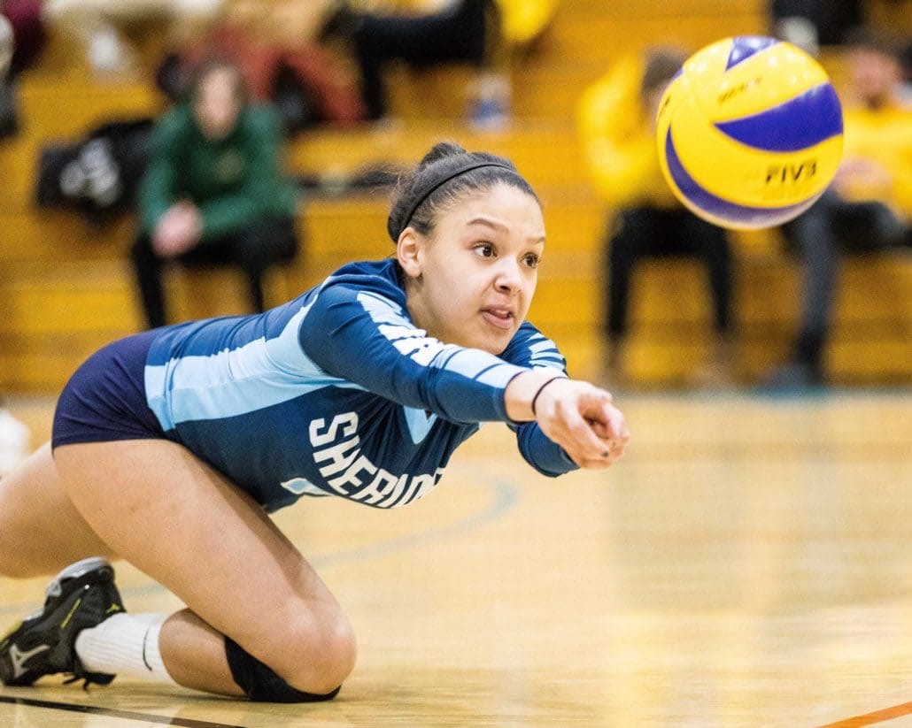 OAKVILLE, ON - JAN. 13, 2018: Sydney Romans of the Sheridan Bruins dives during OCAA women's volleyball action against the St. Clair Saints.