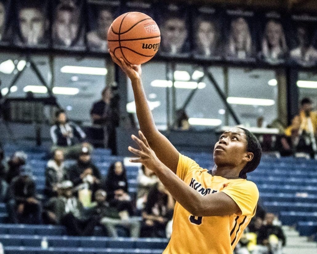 TORONTO, ON - Nov. 12, 2016 - Aleena Domingo of the Humber Hawks stretches for a lay-up.