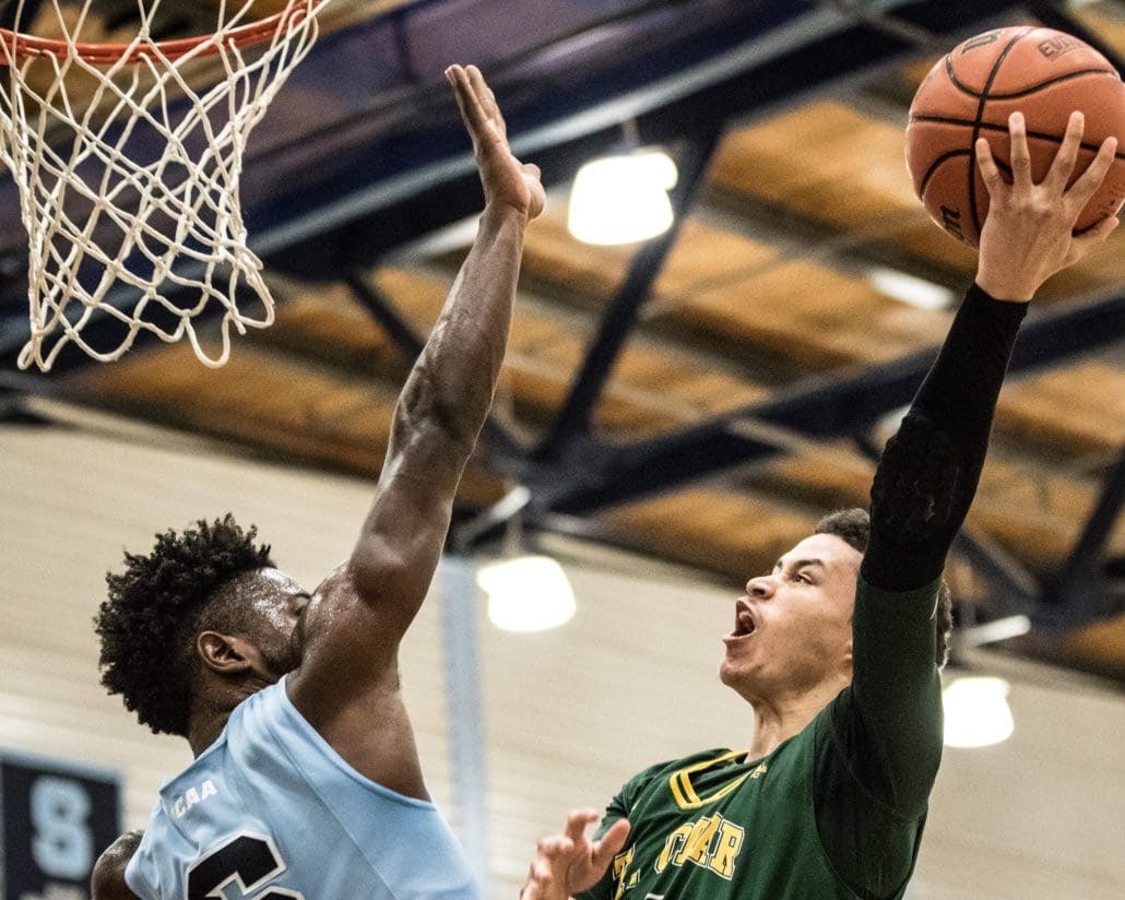 BRAMPTON, ON – Nov. 27, 2016 – Nick Campbell of the Sheridan Bruins guards a shot from William Lara-Caston of the St. Clair Saints in OCAA action.