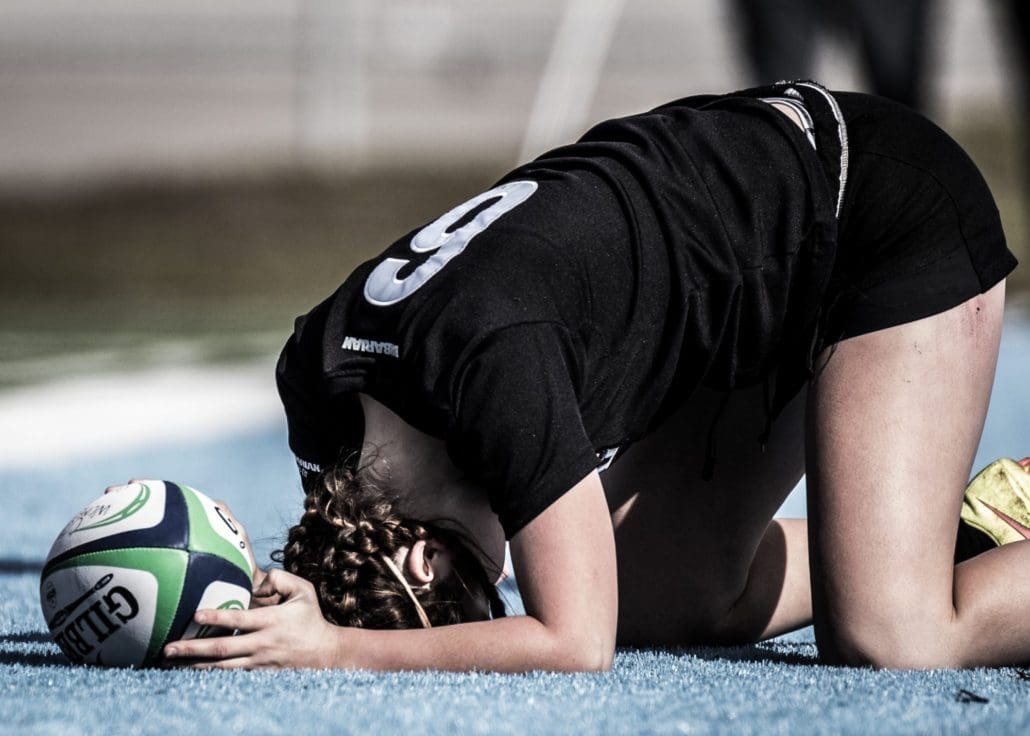 OAKVILLE, ON - Nov. 5, 2016: Seneca player collapses for a breather after sprinting the length of the pitch for a try.