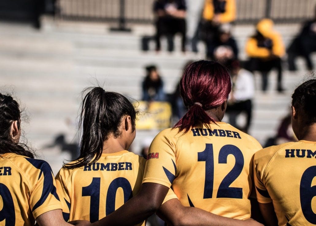 OAKVILLE, ON - Nov. 5, 2016: Humber players stand together during the national anthems at the inaugural OCAA Women's Rugby Sevens Championship.